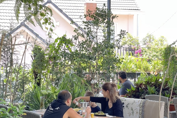 Well taken care outdoor area with lots of green, comfortable seatings.